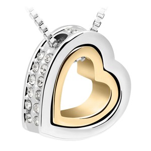 Zilverkleurig hart met crystallen aan de buitenkant en een goudkleurig hartje aan de binnenkant