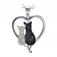 Silver Chain with Black & White Zirconia Cats sitting in a Silver Heart