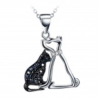 Silver Chain with a Pendant of a Black Zirconia Cat sitting next to a Dog with a small white Cubic Zirconia collar.