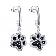 Silver dog paw earrings with black and white zirconia stones